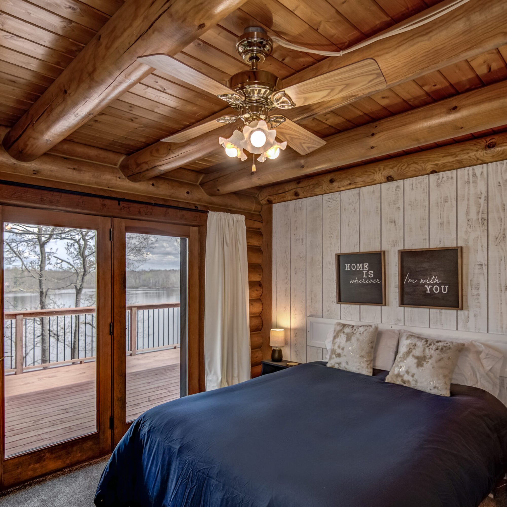 Bedroom with deck access and lake view